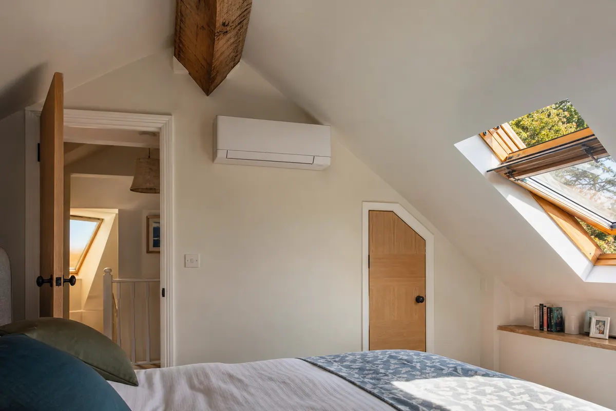 Wall-mounted air conditioning unit in a loft conversion Wall-mounted air conditioning unit in a loft conversion